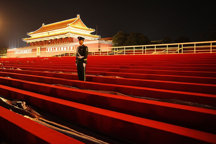 A guard stands on the temporary reviewing stand built for the National Day celebration on Tiananmen Square on Sept. 28, 2009 in Beijing. (Feng Li/Getty Images)