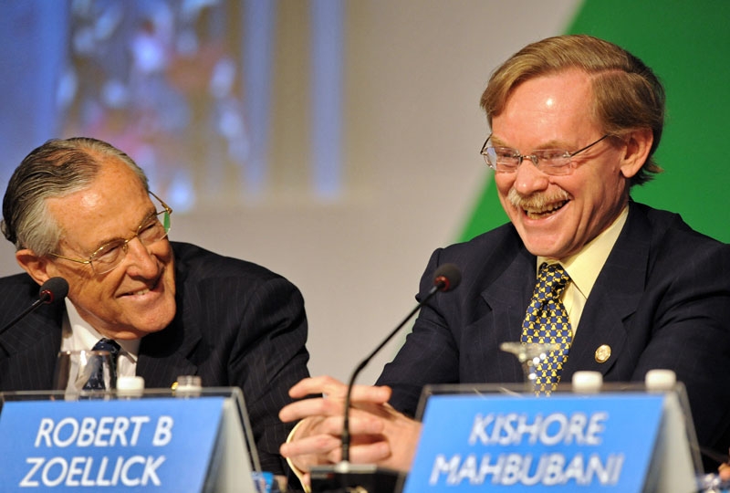 Richard Woolcott (L), former Australian secretary of foreign affairs and trade, shares a light moment with Robert Zoellick (R), president of the World Bank, during the APEC 20th anniversary high-level symposium on November 10, 2009 in Singapore. (Roslan Rahman/AFP/Getty Images)