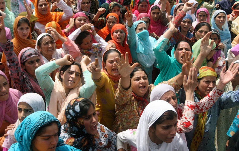 Kashmiri Muslim women shout slogans during the funeral procession of 19-year old Syed Farrukh Bukhari in Kreeri, north of Srinagar, on August 11, 2010. (Rouf Bhat/AFP/Getty Images)