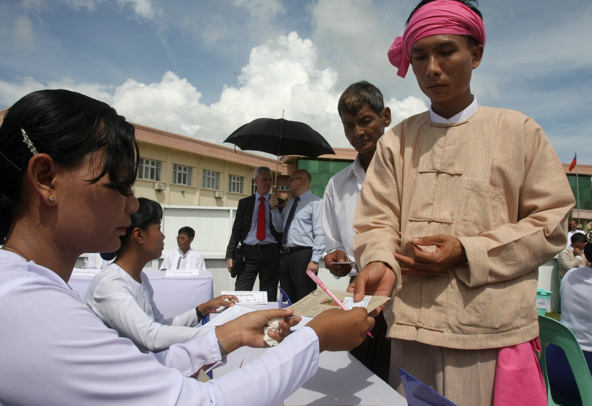 Votes queue to collect their ballot papers during a demonstration of how to vote in Naypyidaw. (Soe Than Win/AFP/Getty Images)