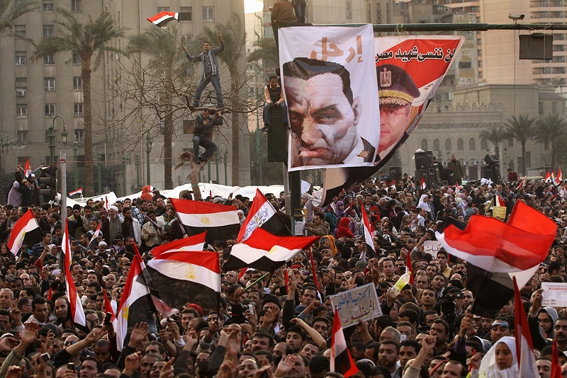 Anti-government protesters cheer in Cairo's Tahrir Square on February 8, 2011. (John Moore/Getty Images) 