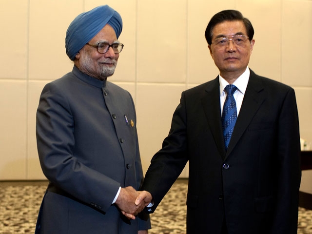 Indian Prime Minister Manmohan Singh (L) with Chinese President Hu Jintao in Sanya, China on Apr. 13, 2011. Both India and China declined to link India's missile test on Apr. 19, 2012 with the state of their relations. (Nelson Ching/AFP/Getty Images) 
