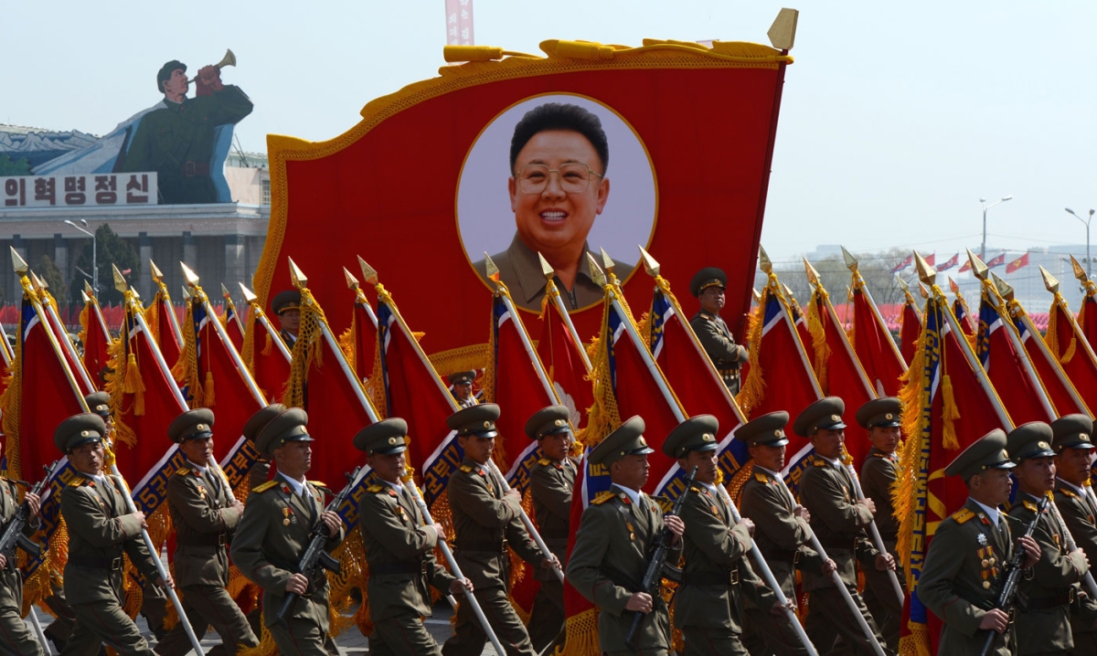 North Korean soldiers carry a portrait of late leader Kim Jong-Il during a military parade to mark 100 years since the birth of the country's founder Kim Il-Sung in Pyongyang on April 15, 2012. (Pedro Ugarte/AFP/Getty Images)      