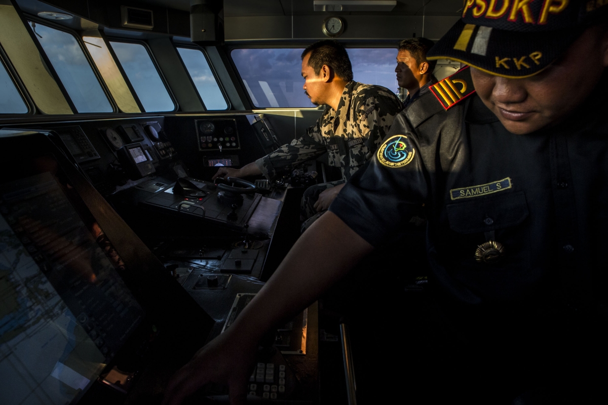 Security ship crews of Ministry of Maritime Affairs and Fisheries, monitor radar during a patrol in the South China Sea on August 17, 2016 in Natuna, Ranai, Indonesia. 