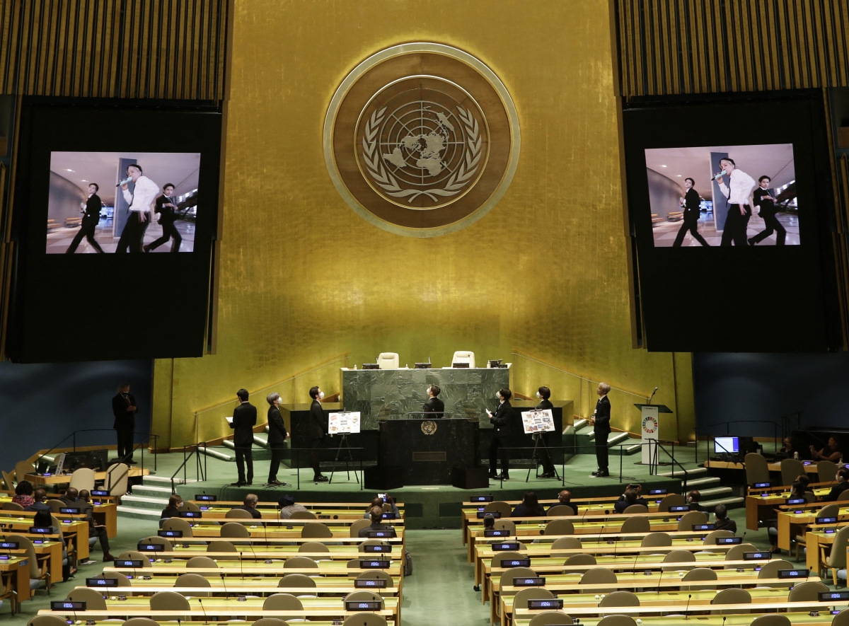 Members of South Korean boy band BTS watch a music video as part of the UN General Assembly 76th session