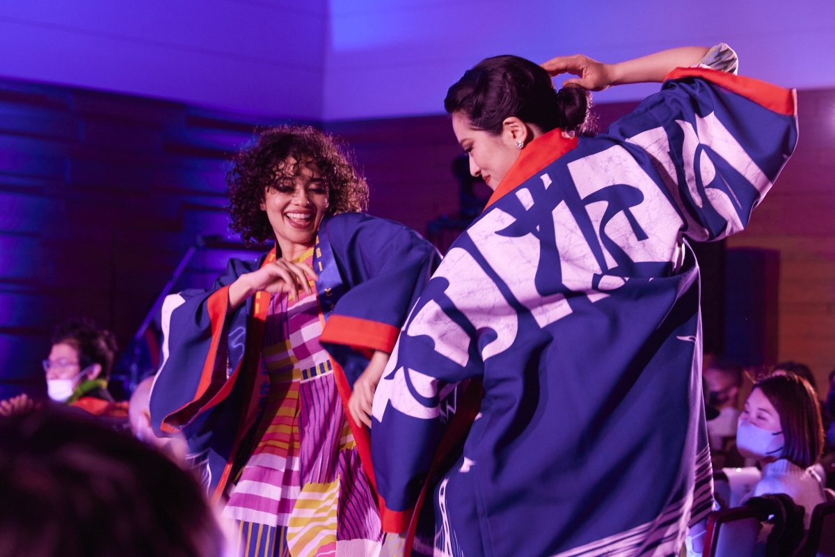 Executive Producer and choreographer Sophia Noel and choreographer Sayuri Hirayama opens the performance to the music of Mura Matsuri performed by Akira Tana and the Otonowa Band.
