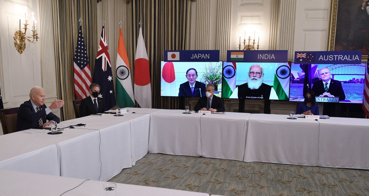 US President Joe Biden (L), with Secretary of State Antony Blinken (2nd L), meets virtually with members of the "Quad" alliance of Australia, India, Japan and the US, in the State Dining Room of the White House in Washington, DC, on March 12, 2021. - On screens are Japanese Prime Minister Yoshihide Suga, Indian Prime Minister Narendra Modi and Australian Prime Minister Scott Morrison.