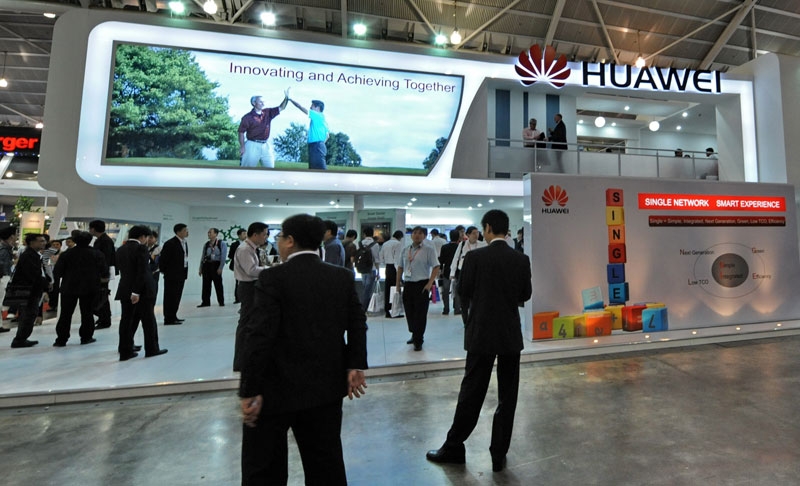 People visiting Huawei Technologies booth display of its product during CommunicAsia 2010 conference and exhibtion show in Singapore. (Roslan Rahman/AFP/Getty Images) 