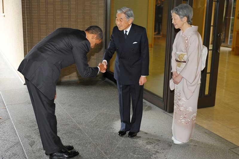 President Obama bows as he shakes hands with Japanese Emperor Akihito and as Empress Michicko looks on at the Imperial Palace in Tokyo, on November 14, 2009. The bow has sparked controversy in the US where some argue that no sitting president should bow to another head of state. (Mandel Ngan/AFP/Getty Images)