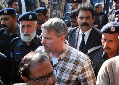 Pakistani police escort arrested US national Raymond Davis (C) to a court in Lahore on Jan. 28, 2011. On Feb. 17 a Pakistan court adjourned until Mar. 14, without ruling whether the CIA employee accused by police of murdering two men qualifies for diplomatic immunity. (Arif Ali/AFP/Getty Images) 
