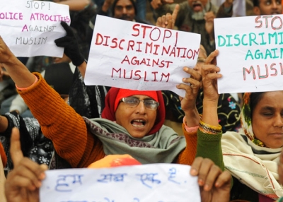 Muslim women from Indian state of Gujarat shout anti-government slogans during a protest in New Delhi on December 28, 2010 against the discrimination, exclusion and persecution of Muslims. (Raveendran/AFP/Getty Images)