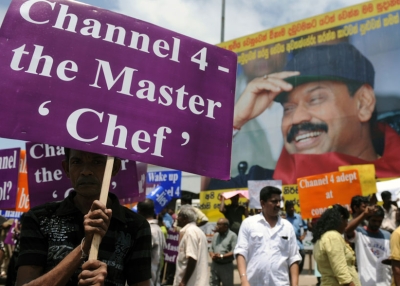 Sri Lankan state workers and ruling party activists protest outside the main railway station in Colombo on August 2, 2011. The protest was aimed to denounce Britain's Channel 4 documentary 'Sri Lanka's Killing Fields'. (Ishara S. Kodikara/AFP/Getty Images)