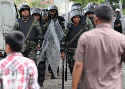 Maldives army soldiers patrol during Friday prayers in Male on February 10, 2012. A U.N. special envoy arrived February 10 for talks with the new administration in the Maldives, as former president Mohamed Nasheed demanded fresh elections after being ousted in what he called a coup d'etat. (Ishara S. Kodikara/AFP/Getty Images)