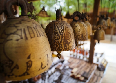 An assortment of intricately decorated bells hang in a souvenir shop in Bagan, Myanmar on May 6, 2015. (Alex Mueller/Flickr)