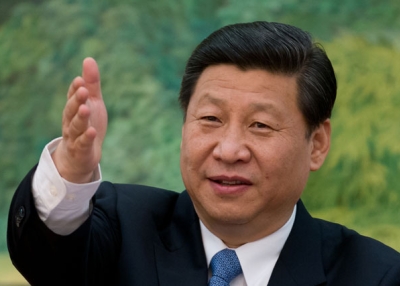 China's newly appointed leader Xi Jinping gestures as he attends a meeting with "foreign experts" at the Great Hall of the People in Beijing on December 5, 2012. (Ed Jones/AFP/Getty Images)