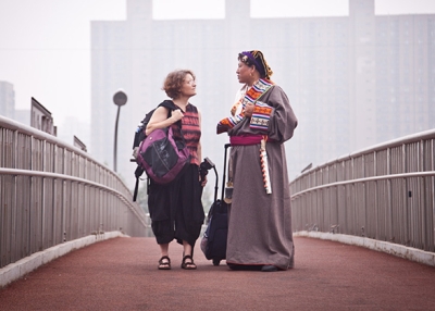 Reporter Jocelyn Ford and Zanta, the subject of her film, stand on a Beijing overpass. (Jocelyn Ford)