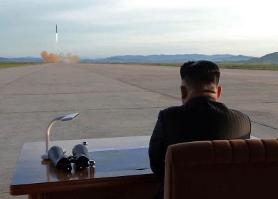 North Korean leader Kim Jong-Un watches a launching drill of the medium-and-long range strategic ballistic rocket Hwasong-12. (STR/AFP/Getty)