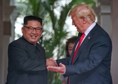 Kim Jong Un and President Trump congratulate each other following Tuesday's summit in Singapore.