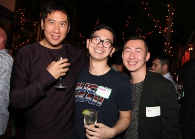 Friends smile for the camera at Asia Society's LGBT Connections Night. 