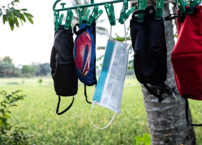 Nurse April Abrias' facemasks are hung out to dry after being washed so they can be reused
