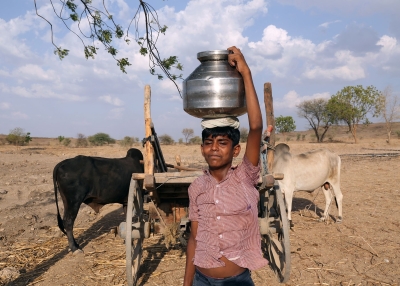 Young boy carried his household water 