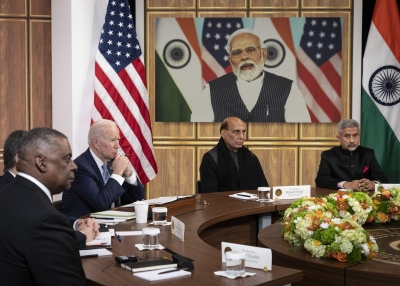 U.S. Defense Secretary Lloyd Austin, U.S. President Joe Biden, Indian Minister of Defense Rajnath Singh, and Indian Foreign Minister Subrahmanyam Jaishankar listen as Prime Minister of India Narendra Modi (on screen) speaks during a virtual meeting in the South Court Auditorium of the White House complex.