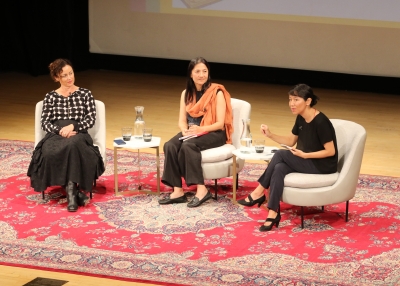 Three women sitting and discussing
