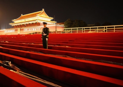 A guard stands on the temporary reviewing stand built for the National Day celebration on Tiananmen Square on Sept. 28, 2009 in Beijing.Â 