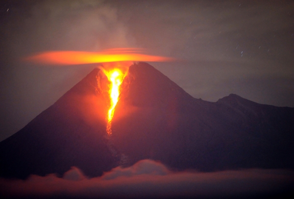 Molten lava flows from the crater of Mount Merapi in central Java on November 2, 2010.