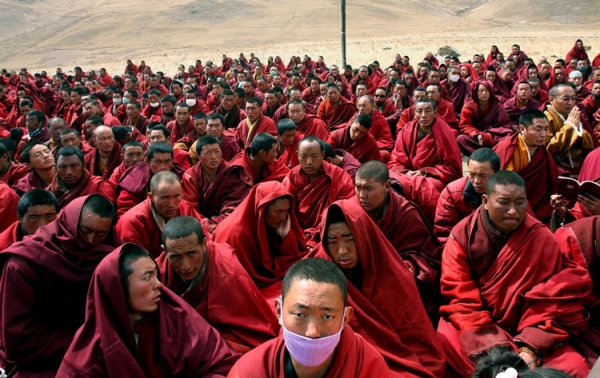 Tibetan monks gathered outside their destroyed monastery in Jiegu, in Yushu county, on Apr. 20. China declared a national day of mourning for earthquake victims as rescuers battled altitude sickness and bad weather in the Tibetan disaster zone. (STR/AFP/Getty Images)