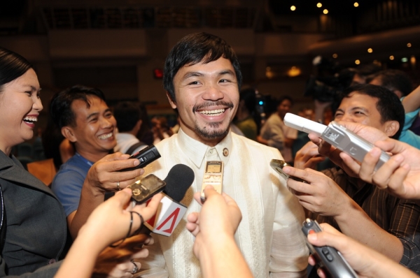 The most popular man in the Philippines, boxing hero Manny Pacquiao was elected to the House of Representatives, in the 15th Congress of the Philippines, in May. Pacquiao spoke to the media at his orientation seminar at the House of Representatives in Manila on July 8. (Ted Aljibe/AFP/Getty Images)