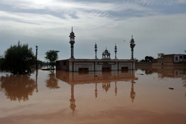 Flash floods and landslides triggered by torrential monsoon rains have killed more than 1600 people in Pakistan and affected upwards of four million people, according to officials. Here a mosque and houses are seen submerged in flood waters near Nowshera on July 30, 2010. (A. Majeed/AFP/Getty Images)