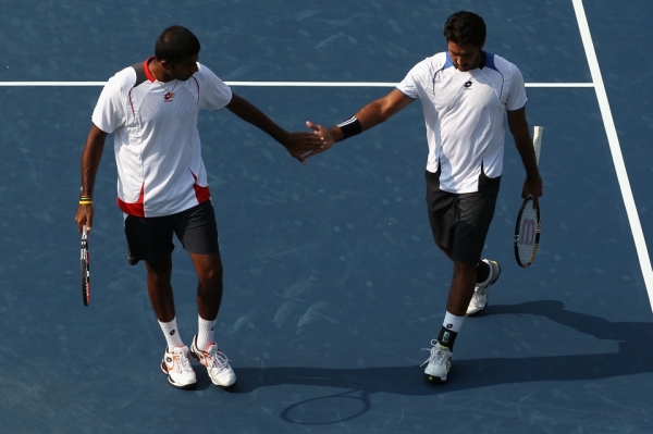 Aisam-Ul-Haq Qureshi (R) of Pakistan shook hands with doubles partner Rohan Bopanna of India after they beat Americans Bob and Mike Bryan in the quarterfinal of the Legg Mason Tennis Classic on Aug. 6 in Washington, DC. Dubbed &quot;the Indo-Pak Express,&quot; Qureshi and Bopanna actively promote reconciliation between Pakistan and India. (Streeter Lecka/Getty Images)