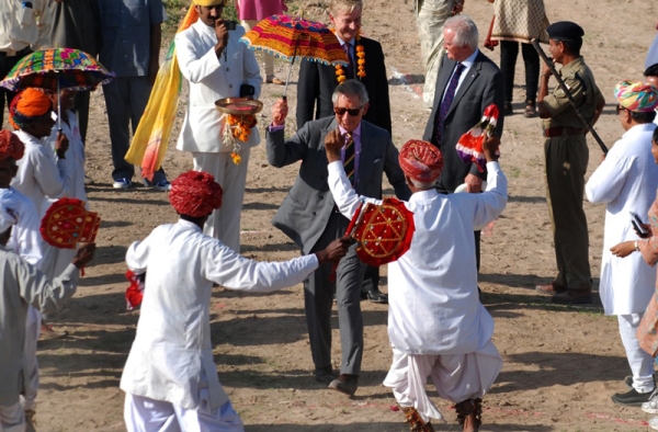In October, Britain&apos;s Prince Charles made a four-day visit to India in which he attended the Commonwealth Games&apos; opening ceremony in New Delhi and toured various parts of the country. He found time for a dance with the residents of Tolasar village, outside Jodhpur, on October 5. (STR/AFP/Getty Images) 