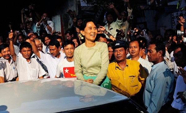 Myanmar&apos;s newly-released opposition leader Aung San Suu Kyi (C) acknowledged supporters as she arrived at the National League for Democracy (NLD) headquarters in Yangon on Nov. 15. Suu Kyi was released from house arrest by Myanmar&apos;s ruling junta on Nov. 13, six days after a general election that was generally seen as fraudulent. (STR/AFP/Getty Images)