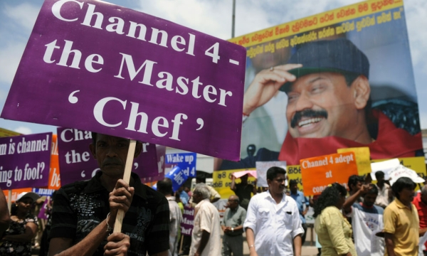 Sri Lankan state workers and ruling party activists protest outside the main railway station in Colombo on August 2, 2011. The protest was aimed to denounce Britain's Channel 4 documentary 'Sri Lanka's Killing Fields'. (Ishara S. Kodikara/AFP/Getty Images)