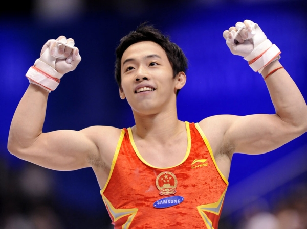 Chinese gymnast Zou Kai, recent victim of a real estate scam, celebrates after a performance at the World Gymnastics Championships in Tokyo on October 16, 2011. (Kazuhiro Nogi/AFP/Getty Images)