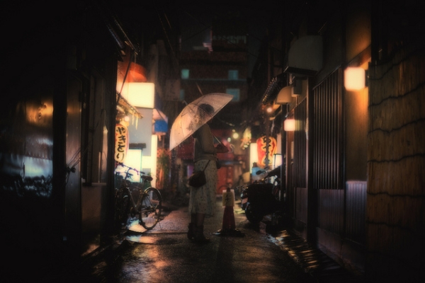 A girl waits in the rain in the Asakusa district of Tokyo, Japan on June 19, 2012. (CaDs/Flickr)