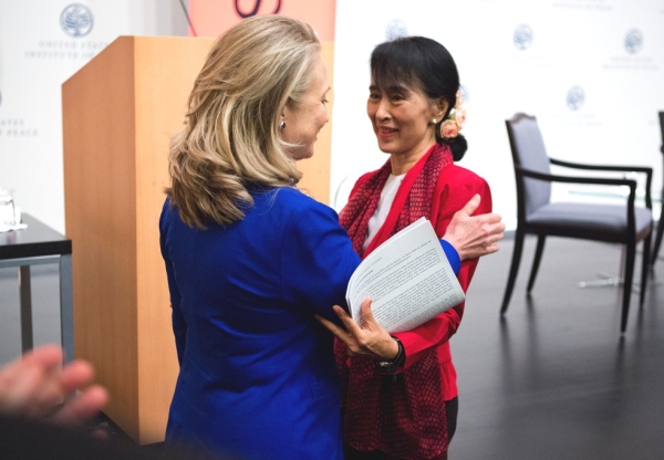 U.S. Secretary of State Hillary R. Clinton greets Aung San Suu Kyi before the Myanmar parliamentarian spoke at the U.S. Institute of Peace in Washington, D.C., Sept. 18, 2012 (Asia Society/Joshua Roberts)