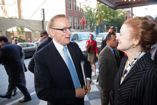 Henrietta Fore greeting Bob Carr at the front of the Pierre Hotel. (Brian Stanton)