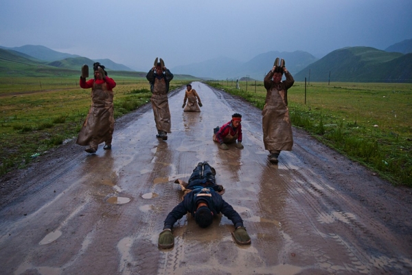 Pilgrims proceed at a snail's pace performing the Chak Tsal, the Tibetan name for ritual prostration (see slide #3). Their journey from Qinghai will take six months, along the northern branch of the Tea Horse Road to the sacred city of Lhasa. (Michael Yamashita)