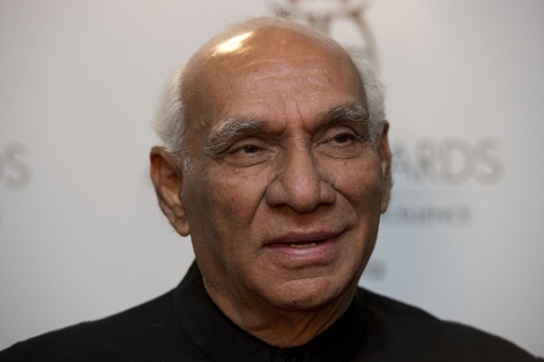 Bollywood filmmaker Yash Chopra poses for the press after winning the Outstanding Achievement in Cinema Award at the Asian Awards at the Grosvenor House Hotel in London on Oct. 26, 2010. (Carl Court/AFP/Getty Images)