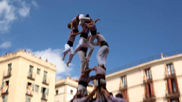 Trust and balance are both crucial to the success of these human towers. From the movie "The Human Tower." (Goldcrest Films International)