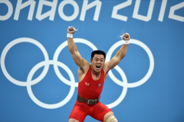 North Korean weightlifter Kim Un Guk celebrating the thrill of victory after winning the gold medal at the Olympics in the Men's 62-kilogram division, setting a world record total of 327 kg in London on July 30, 2012. (Yuri Cortez/AFP/GettyImages)