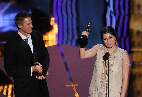 Sharmeen Obaid-Chinoy (shown here with co-director Daniel Junge, L) became the first Pakistani to win an Oscar for her documentary short "Saving Face" at the 84th Annual Academy Awards  in Hollywood, California on February 26, 2012. (Robyn Beck/AFP/Getty Images)
