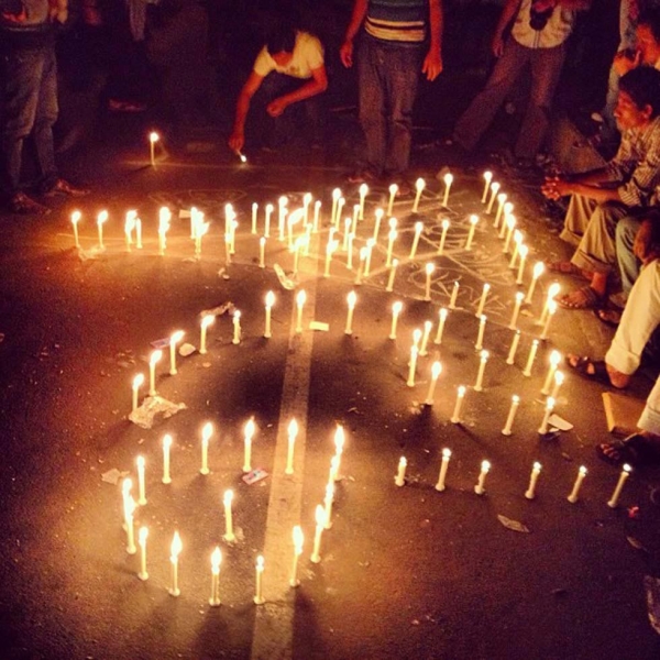 Protestors at Shahbag arrange lit candles to form the number 71 in Bangla, signifying the 1971 Bangladesh Liberation War. (Naorose Bin Ali)