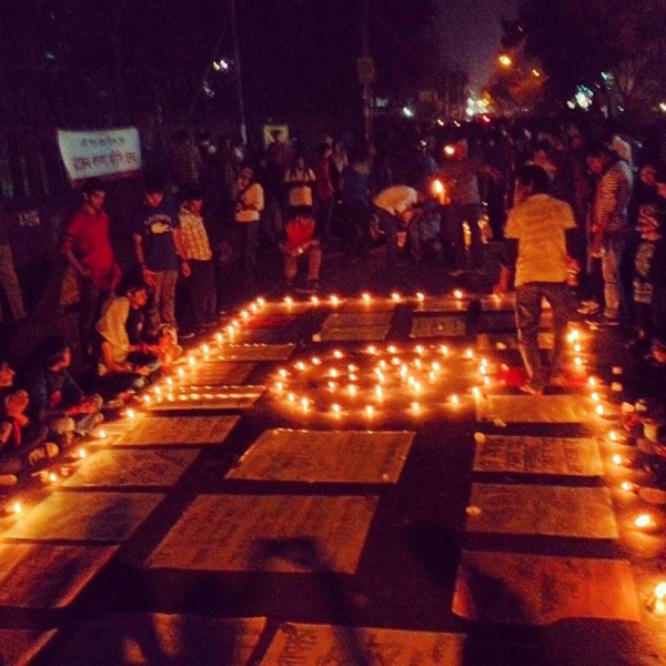 Protestors organize a series of posters and candles as they wait in Shahbag. (Naorose Bin Ali)