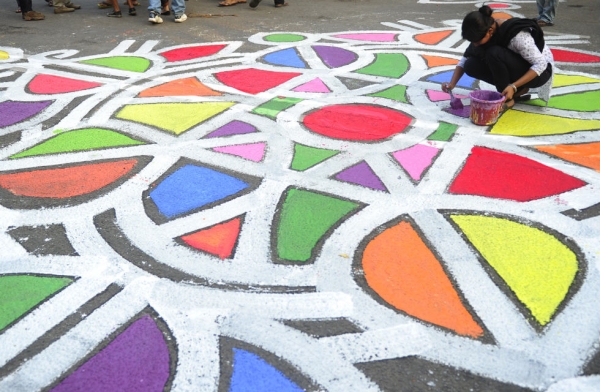 A Bangladeshi fine arts student painting on the street in front of the Shaheed Minar in Dhaka on Feb. 20, 2012. (Munir Uz Zaman/AFP/Getty Images)