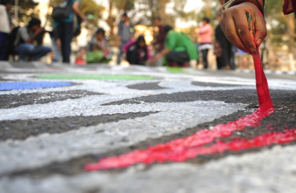 Bangladeshi students paint in front of the Shaheed Minar in Dhaka on Feb. 20, 2012. Language Martyrs Day is marked in Bangladesh to commemorate those who died during protests on February 21, 1952 against the then-Pakistani state government's decision to name Urdu the national language, despite East Pakistan's Bengali-speaking majority. (Munir Uz Zaman/AFP/Getty Images)