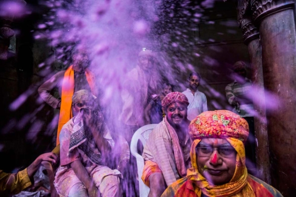People celebrate Holi with colored powders at the Banke Bihari temple in Vrindavan, India on March 26, 2013. (Daniel Berehulak/Getty Images)